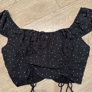 Cropped off shoulder star top